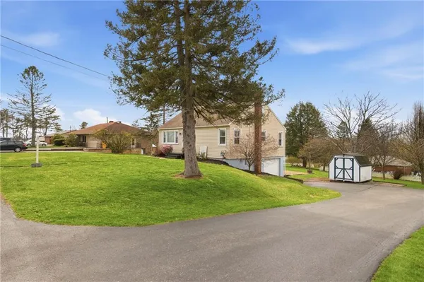 a view of a house with a big yard