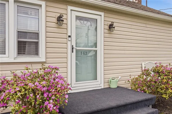 a view of front door with potted plant