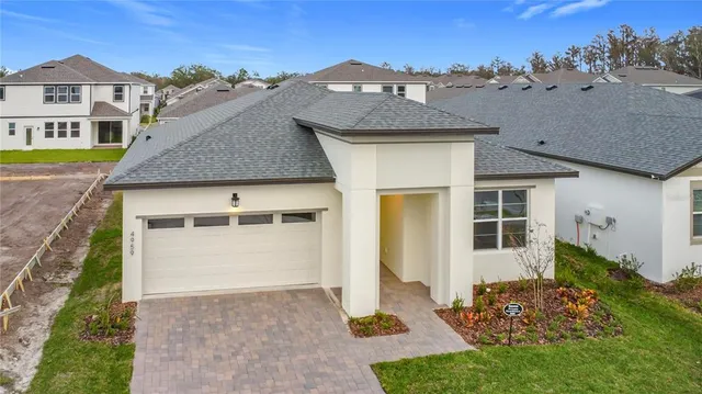 a aerial view of a house with a yard