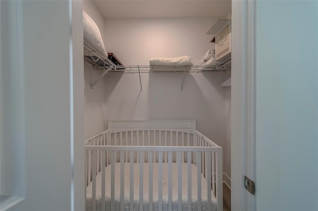 400 150th Avenue, Unit 407 Madeira Beach, FL 33708 - Photo 31 of 59 a view of staircase with white walls and a window