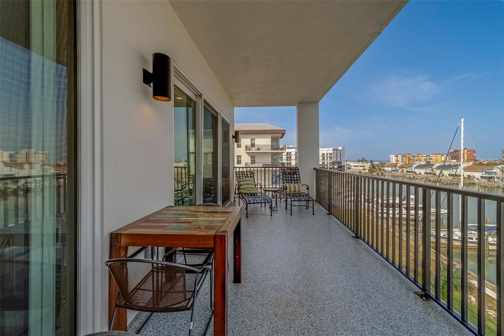 400 150th Avenue, Unit 407 Madeira Beach, FL 33708 - Photo 38 of 59 a view of a balcony and chairs