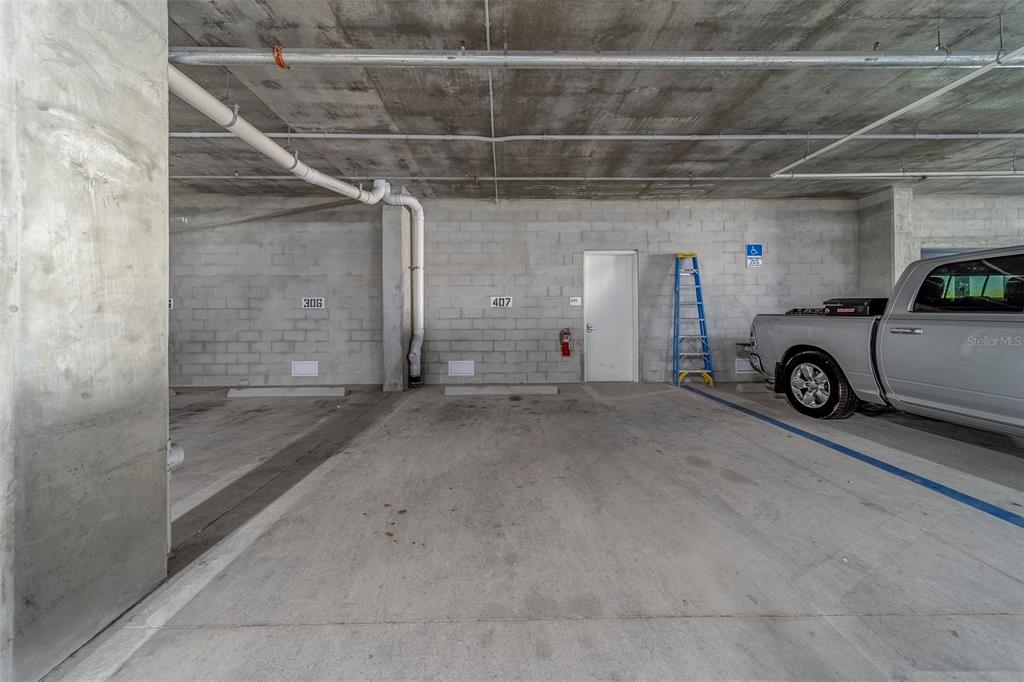 400 150th Avenue, Unit 407 Madeira Beach, FL 33708 - Photo 41 of 59 a view of car garage