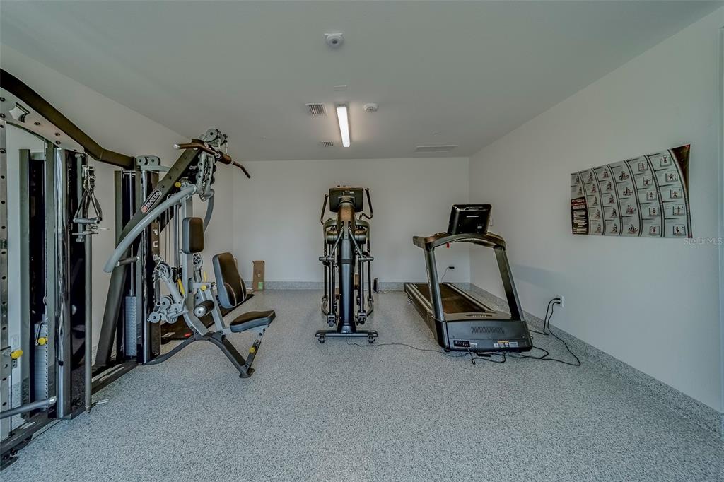 400 150th Avenue, Unit 407 Madeira Beach, FL 33708 - Photo 45 of 59 a view of a room with gym equipment