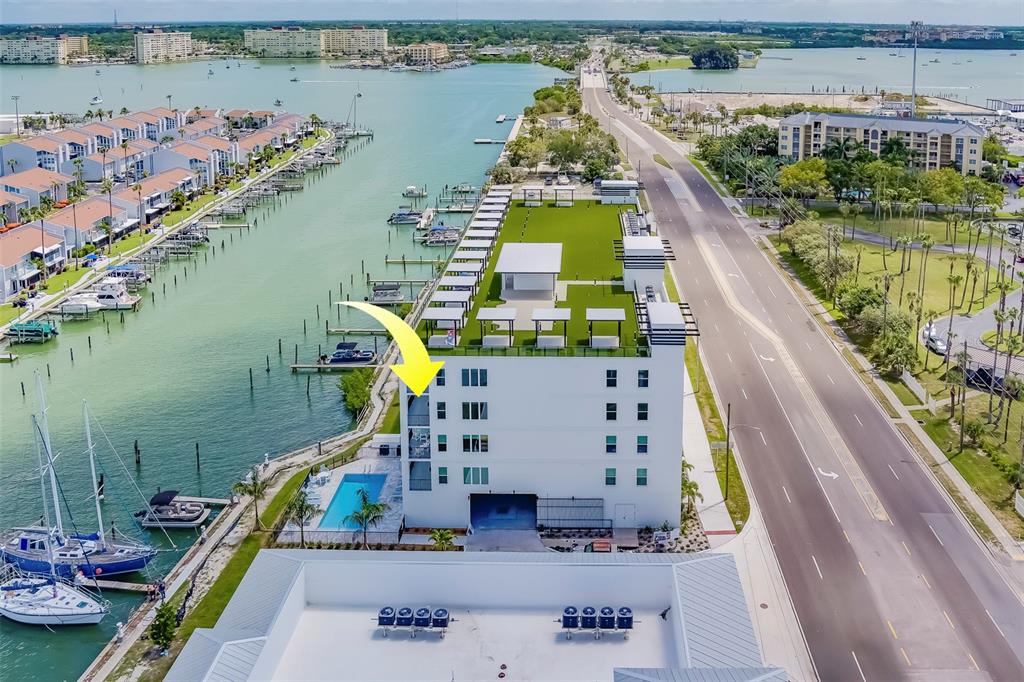 400 150th Avenue, Unit 407 Madeira Beach, FL 33708 - Photo 50 of 59 an aerial view of a house with a swimming pool