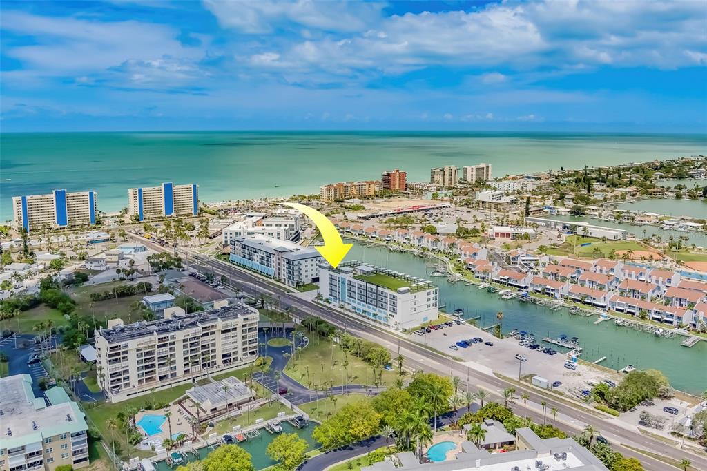 400 150th Avenue, Unit 407 Madeira Beach, FL 33708 - Photo 57 of 59 a view of a city with an ocean view
