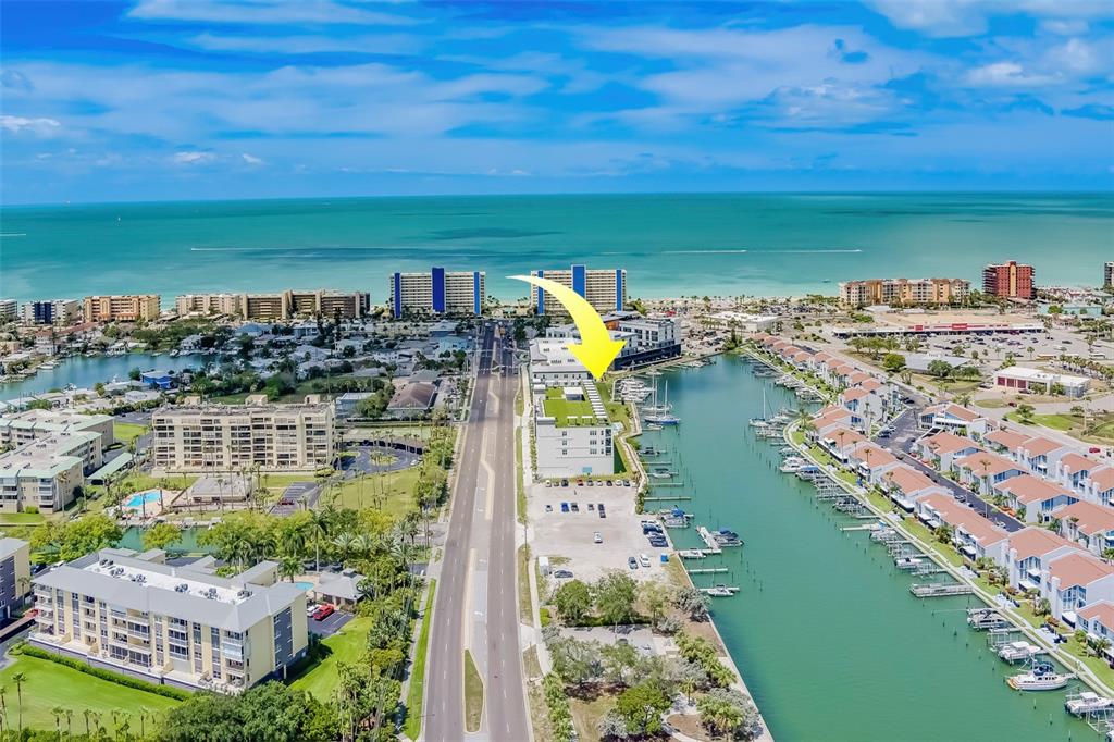 400 150th Avenue, Unit 407 Madeira Beach, FL 33708 - Photo 58 of 59 a view of a city with a lake view