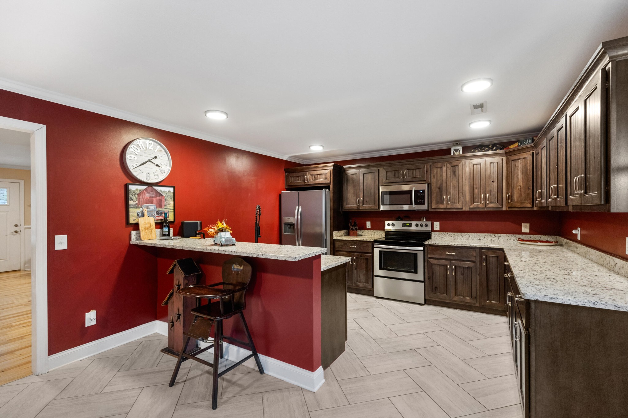 308 Turning Leaf Trail Cleveland, TN 37312 - Photo 4 of 49 a kitchen with stainless steel appliances granite countertop a stove top oven a sink dishwasher and a wooden cabinets