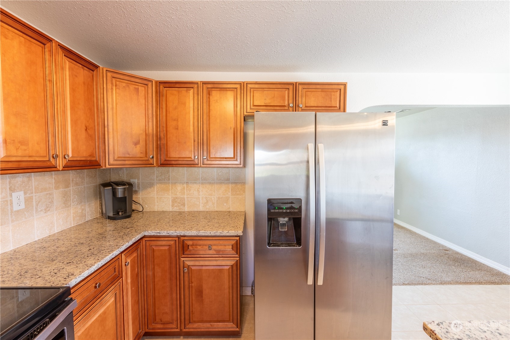 275 Patrick Road Ephrata, WA 98823 - Photo 22 of 35 a kitchen with stainless steel appliances granite countertop a refrigerator and a sink