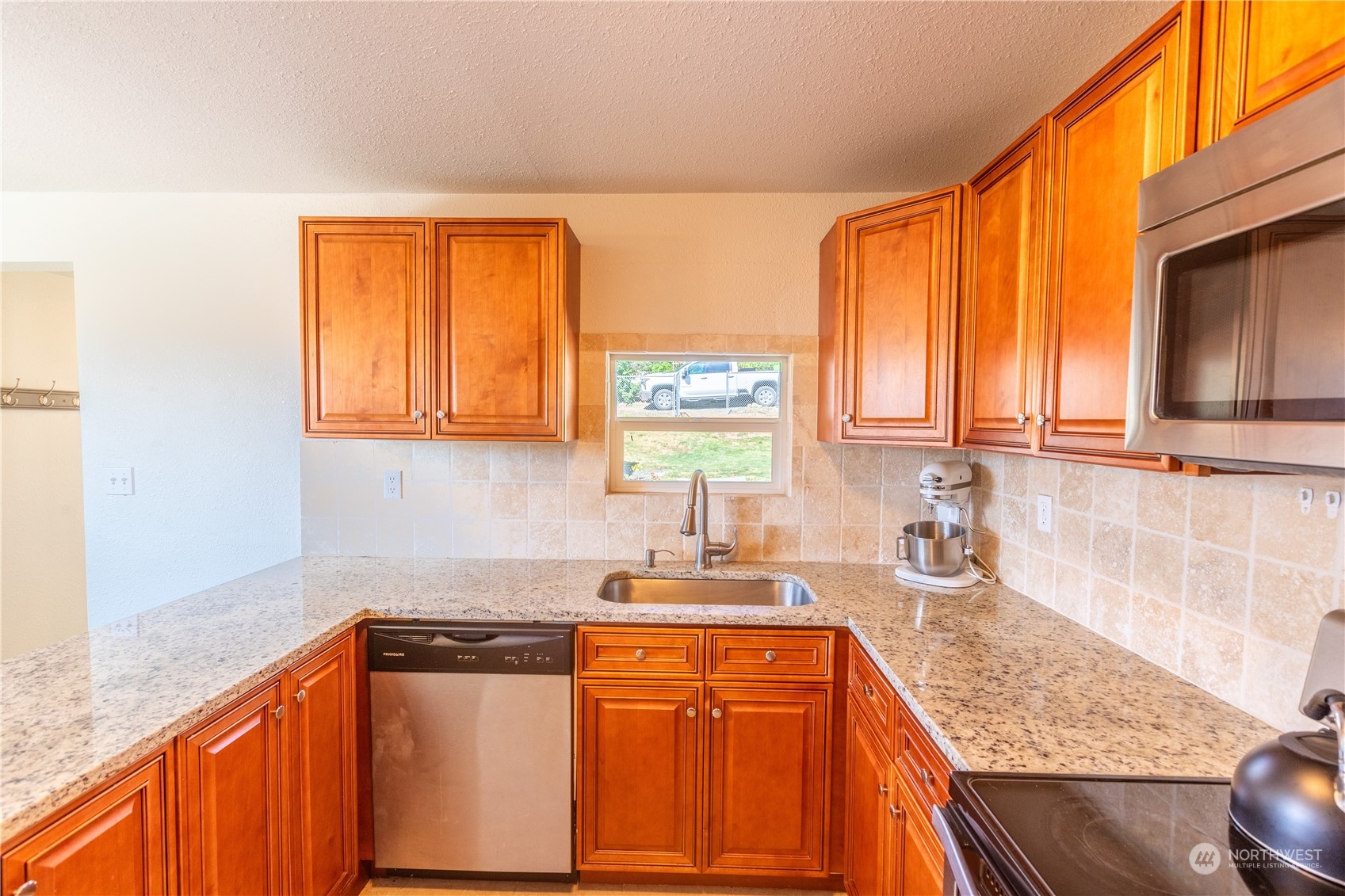 275 Patrick Road Ephrata, WA 98823 - Photo 23 of 35 a kitchen with stainless steel appliances granite countertop a sink stove and cabinets