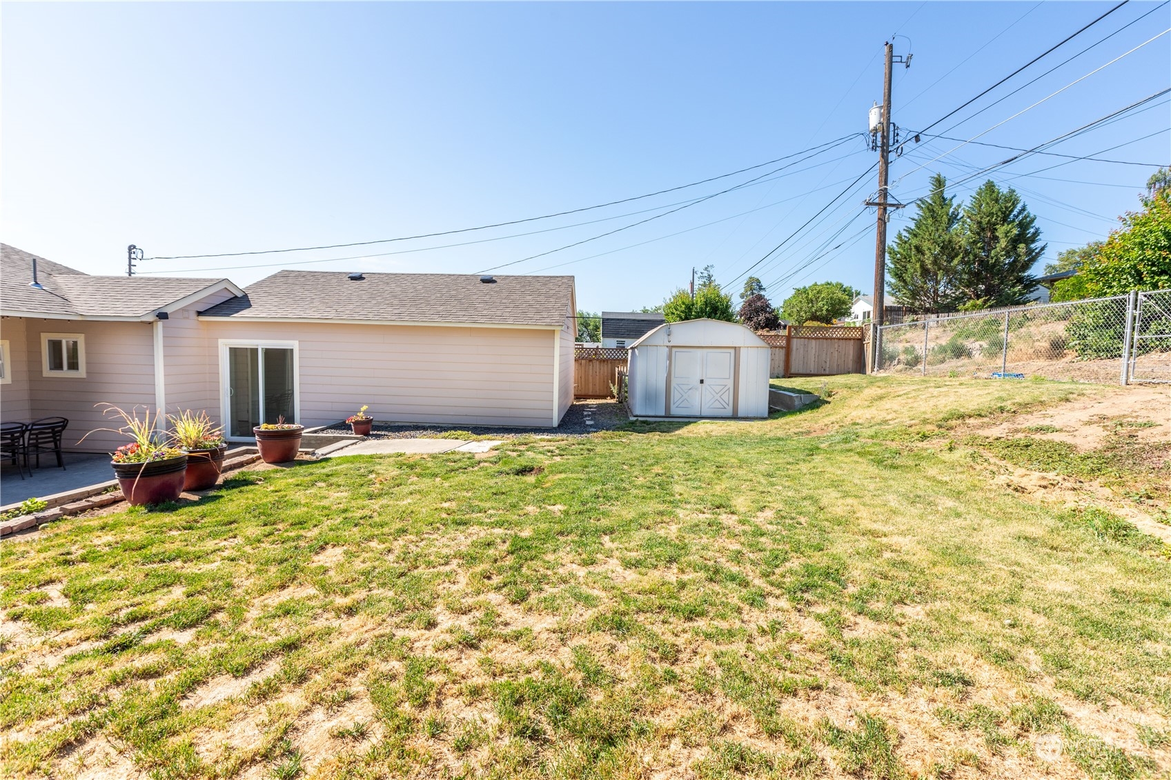 275 Patrick Road Ephrata, WA 98823 - Photo 34 of 35 a view of a house with backyard and sitting area
