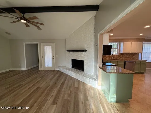 a view of a kitchen with furniture and a fireplace