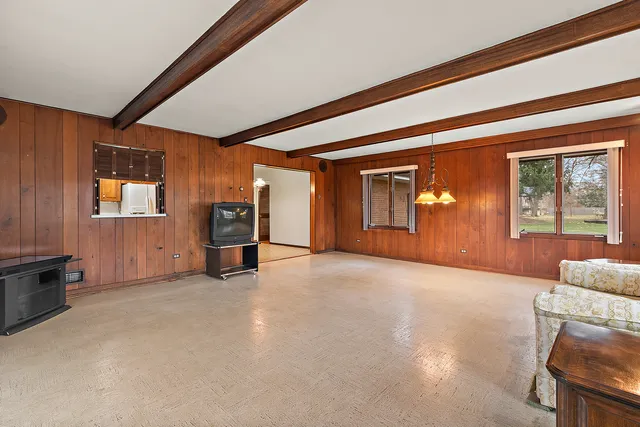 a view of a livingroom with furniture and windows
