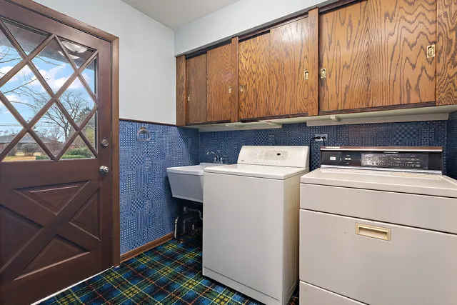 a utility room with dryer and washer