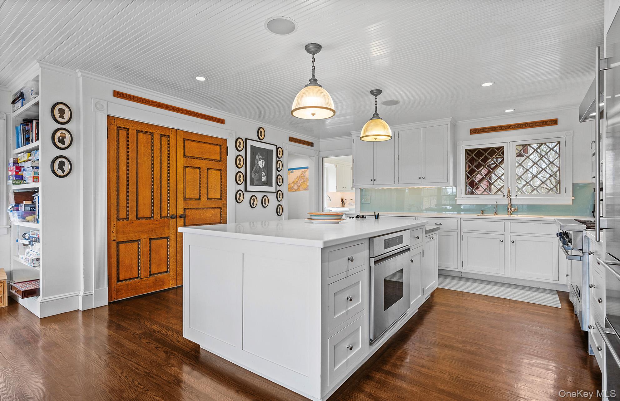 322 Rose Hill Road Water Mill, NY 11976 - Photo 28 of 33 a kitchen with a stove cabinets and wooden floor
