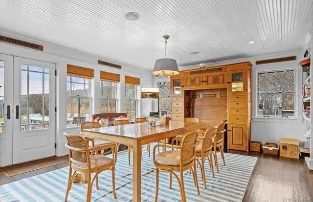 a view of kitchen with furniture and wooden floor