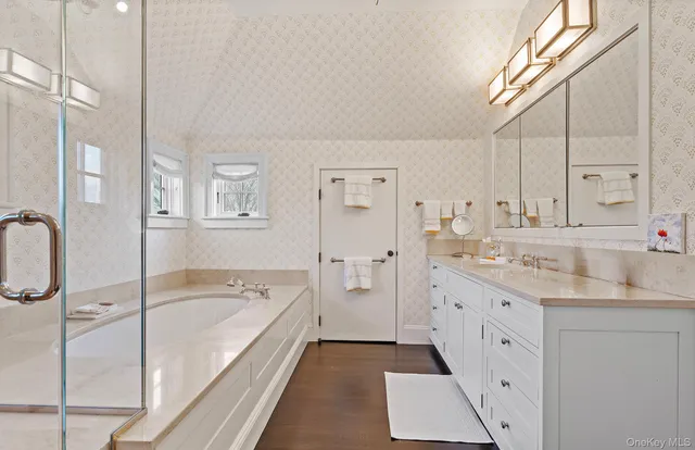 a bedroom with a bed and large window