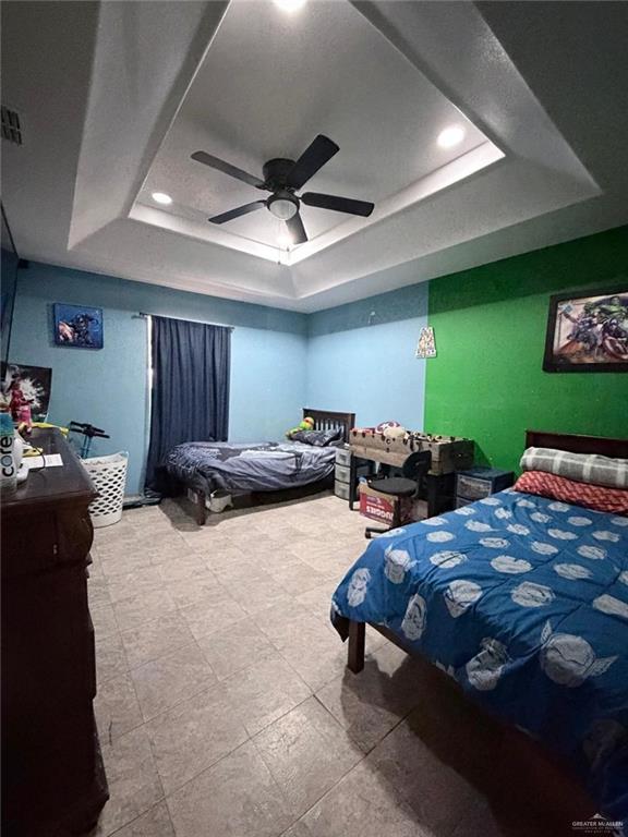 7123 Elisa Street Mission, TX 78574 - Photo 7 of 10 a bed room with furniture and a flat screen tv