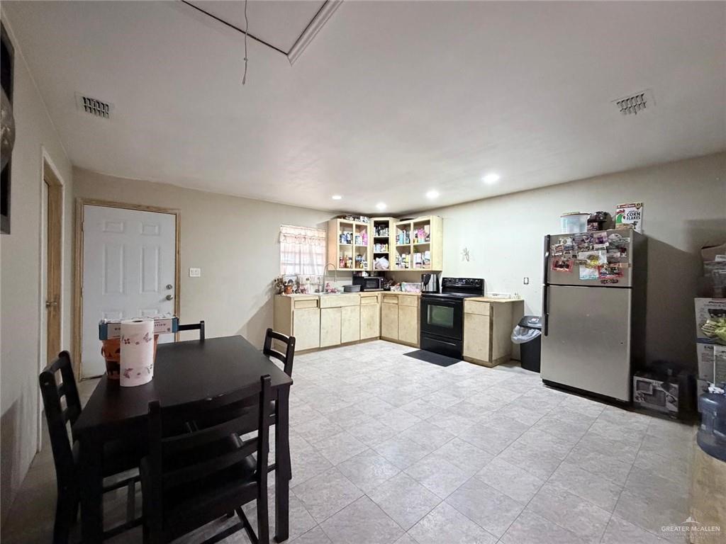 7123 Elisa Street Mission, TX 78574 - Photo 10 of 10 a living room with stainless steel appliances furniture a dining table and kitchen view