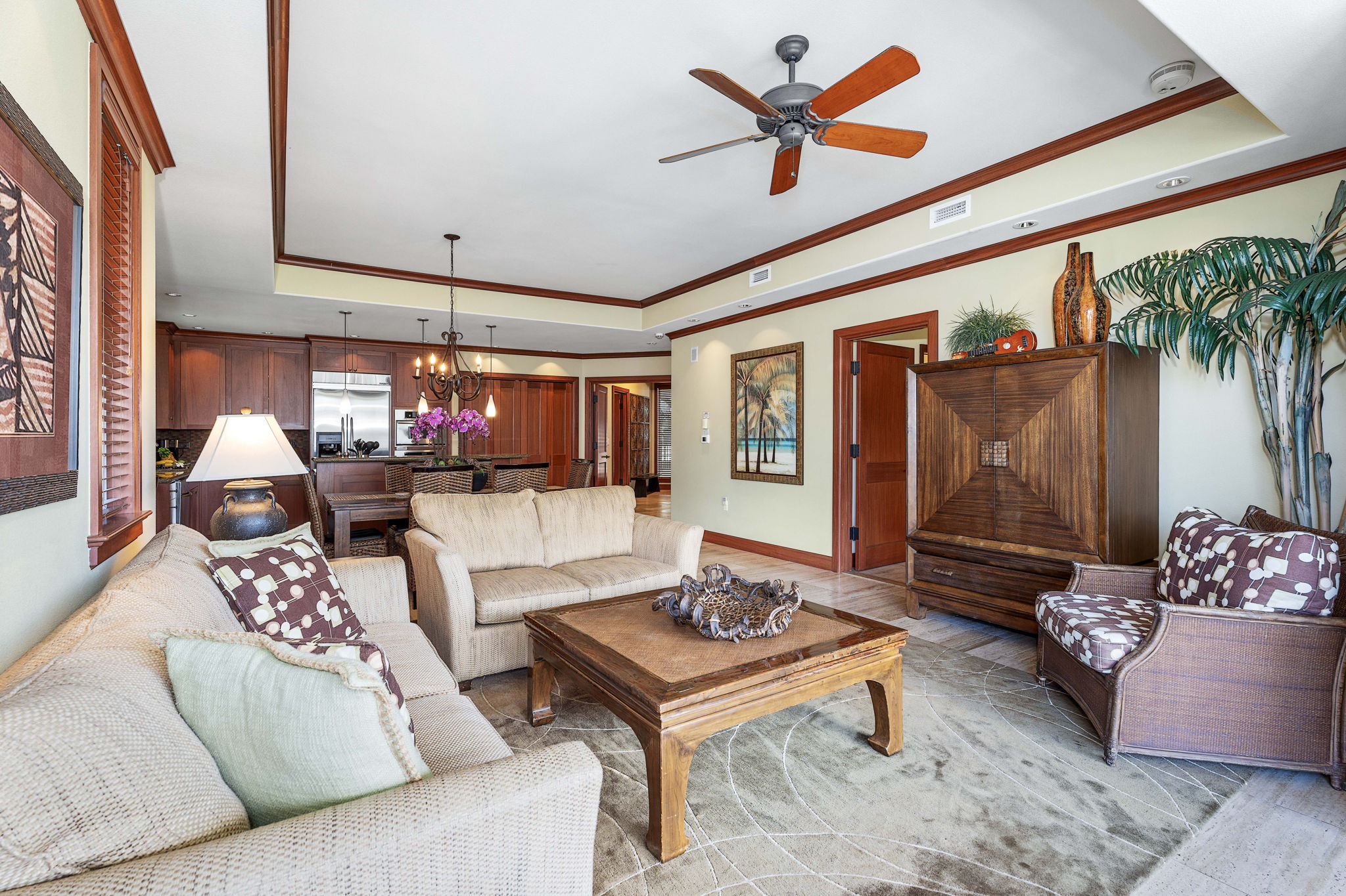 69-1000 Kolea Kai Circle, Unit 15L Waikoloa, HI 96738 - Photo 11 of 29 a living room with furniture and a large window