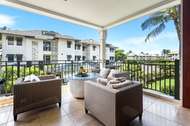 a work room with furniture and a floor to ceiling window