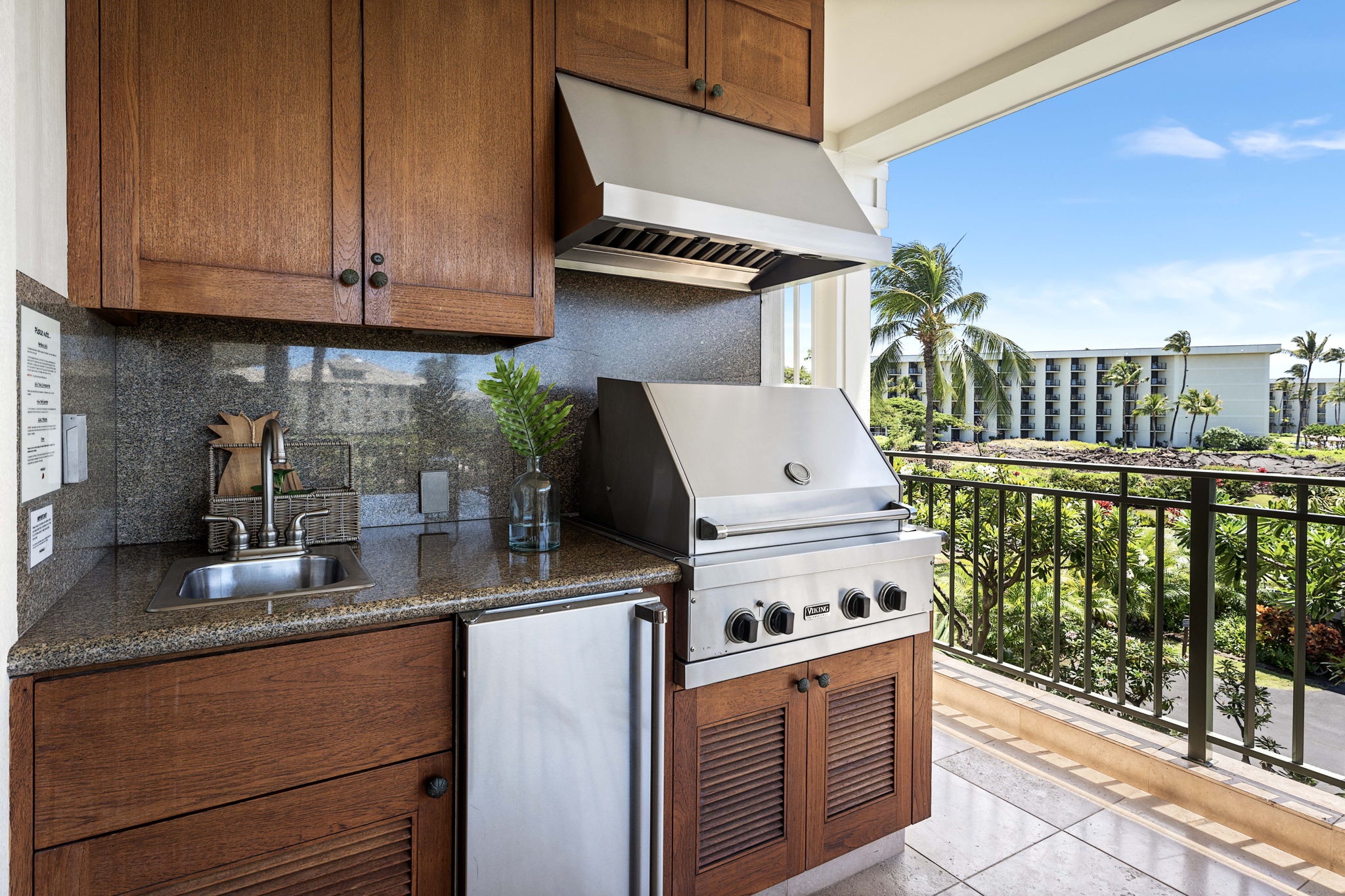 69-1000 Kolea Kai Circle, Unit 15L Waikoloa, HI 96738 - Photo 16 of 29 a kitchen with stove and cabinets