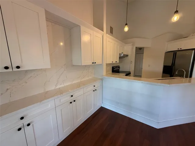 a view of a kitchen with electric equipment