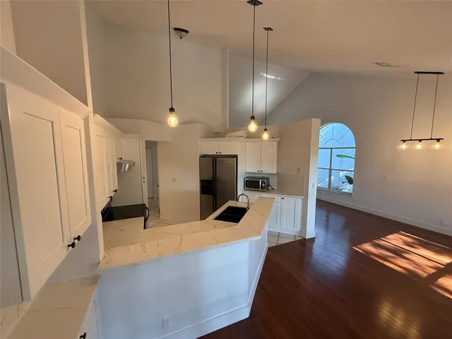 a large living room with wooden floor