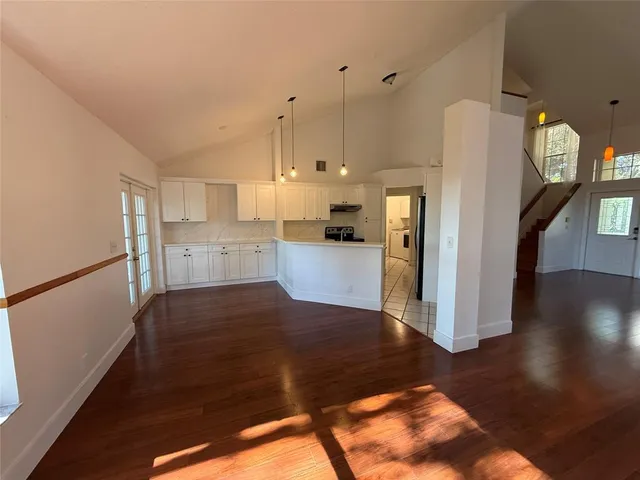 a view of a kitchen with wooden floor