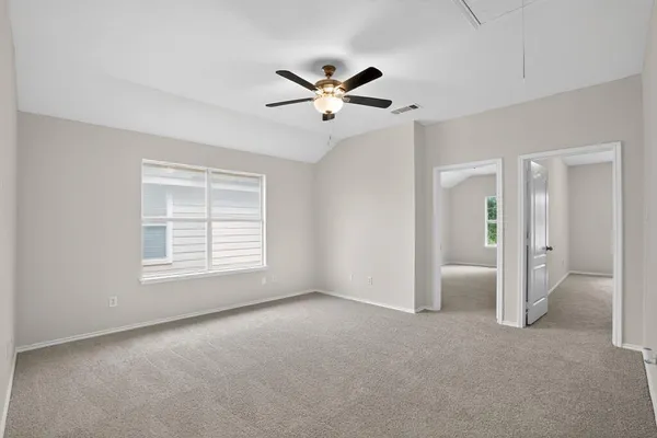 a view of an empty room with a window