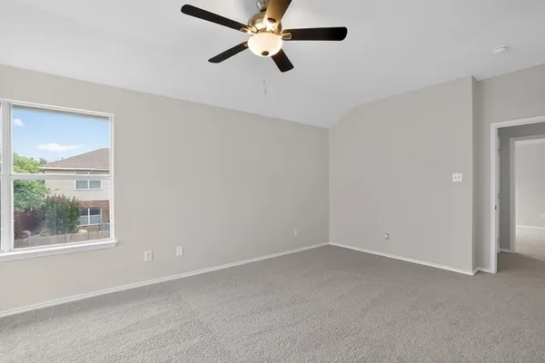 a view of an empty room with a window