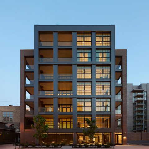 a view of a city room with windows