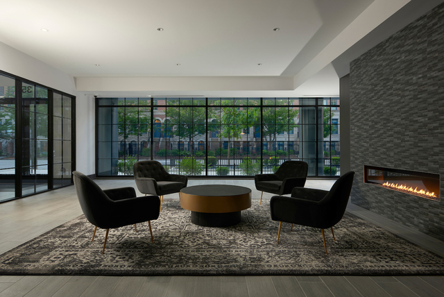 351 West Huron Street, Unit 4 Chicago, IL 60654 - Photo 2 of 30 a living room with furniture and a floor to ceiling window