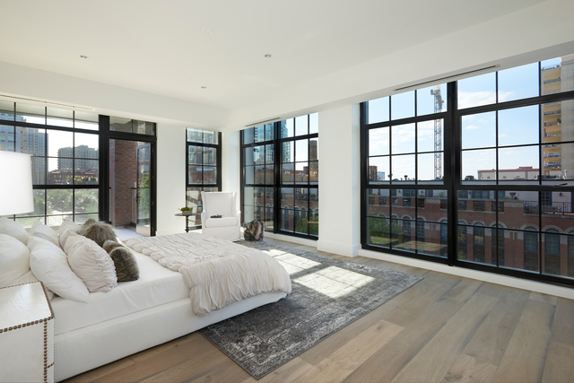 351 West Huron Street, Unit 4 Chicago, IL 60654 - Photo 18 of 30 a spacious bedroom with a bed and a large window