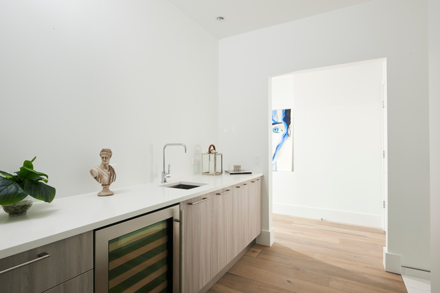 351 West Huron Street, Unit 4 Chicago, IL 60654 - Photo 19 of 30 a kitchen with a sink and a wooden floor