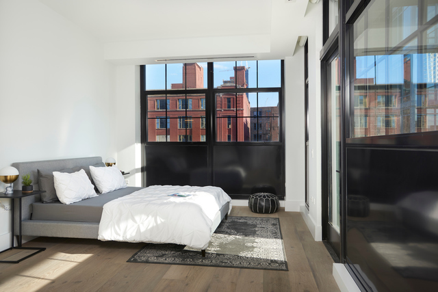 351 West Huron Street, Unit 4 Chicago, IL 60654 - Photo 27 of 30 a living room with furniture and a book shelf