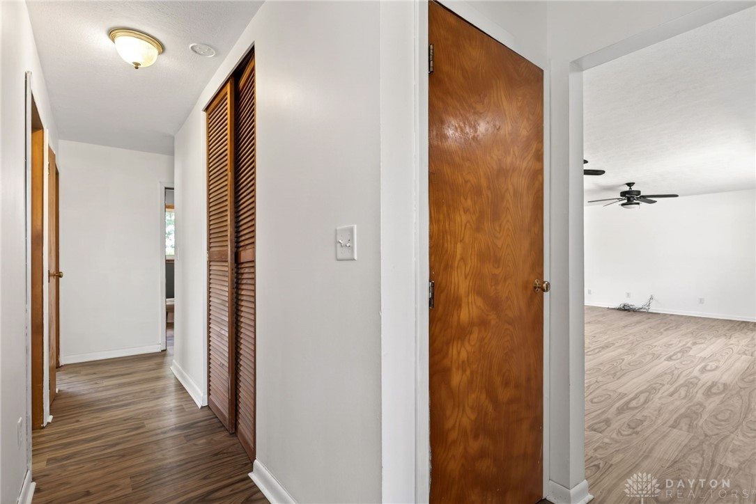 1005 Free Road New Carlisle, OH 45344 - Photo 24 of 43 Hallway leading to open concept living spaces with clean, light-toned flooring.