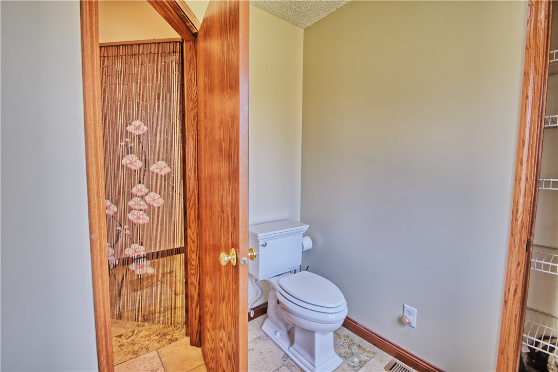 8711 Nicole Lane Springboro, OH 45066 - Photo 48 of 87 This functional powder room features practical flooring and essential fixtures.