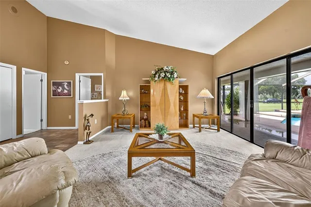 a kitchen with a refrigerator and cabinets