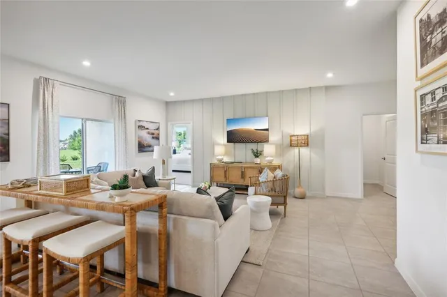 a living room with furniture and a table