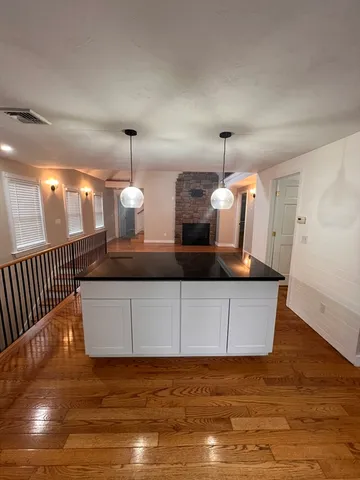a living room with hard wood flooring