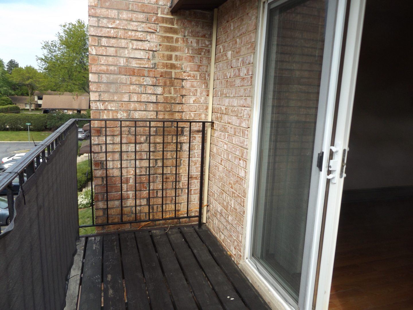 710 West Huntington Commons Road, Unit 3A Mount Prospect, IL 60056 - Photo 8 of 10 a view of balcony with wooden floor