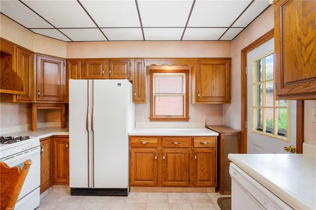 a kitchen with stainless steel appliances a refrigerator and a stove