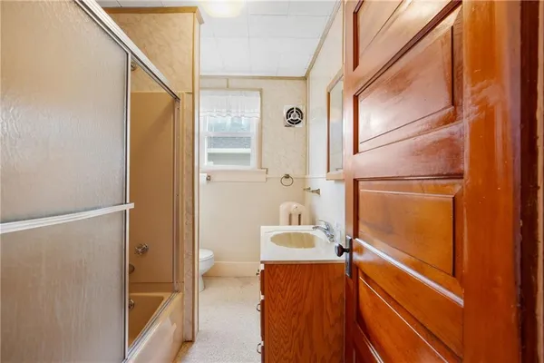 a bathroom with a tub and shower