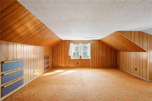 a view of a room with a flesh screen and window