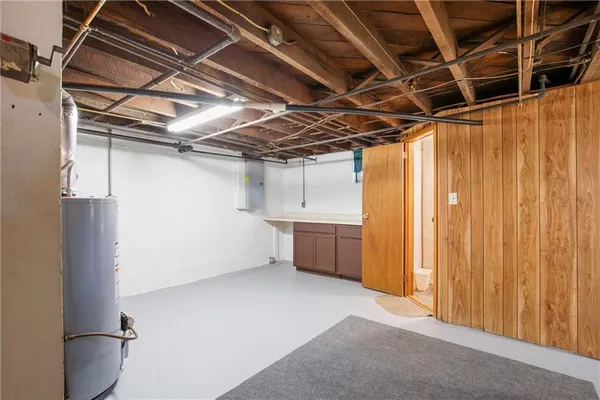 a view of an empty room with a cabinet