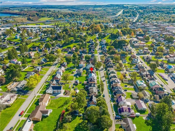 an aerial view of house with yard swimming pool and outdoor seating