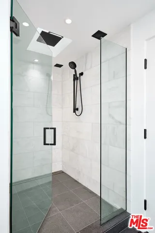 a bathroom with a shower and toilet