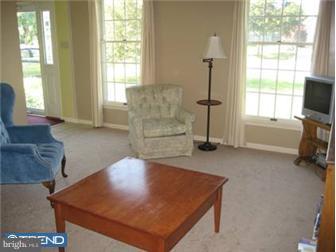 24 Manchester Road Eastampton, NJ 08060 - Photo 3 of 12 a living room with furniture and a flat screen tv