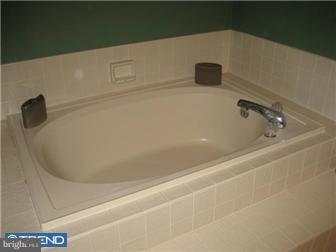 24 Manchester Road Eastampton, NJ 08060 - Photo 8 of 12 a close view of a bathtub in bathroom