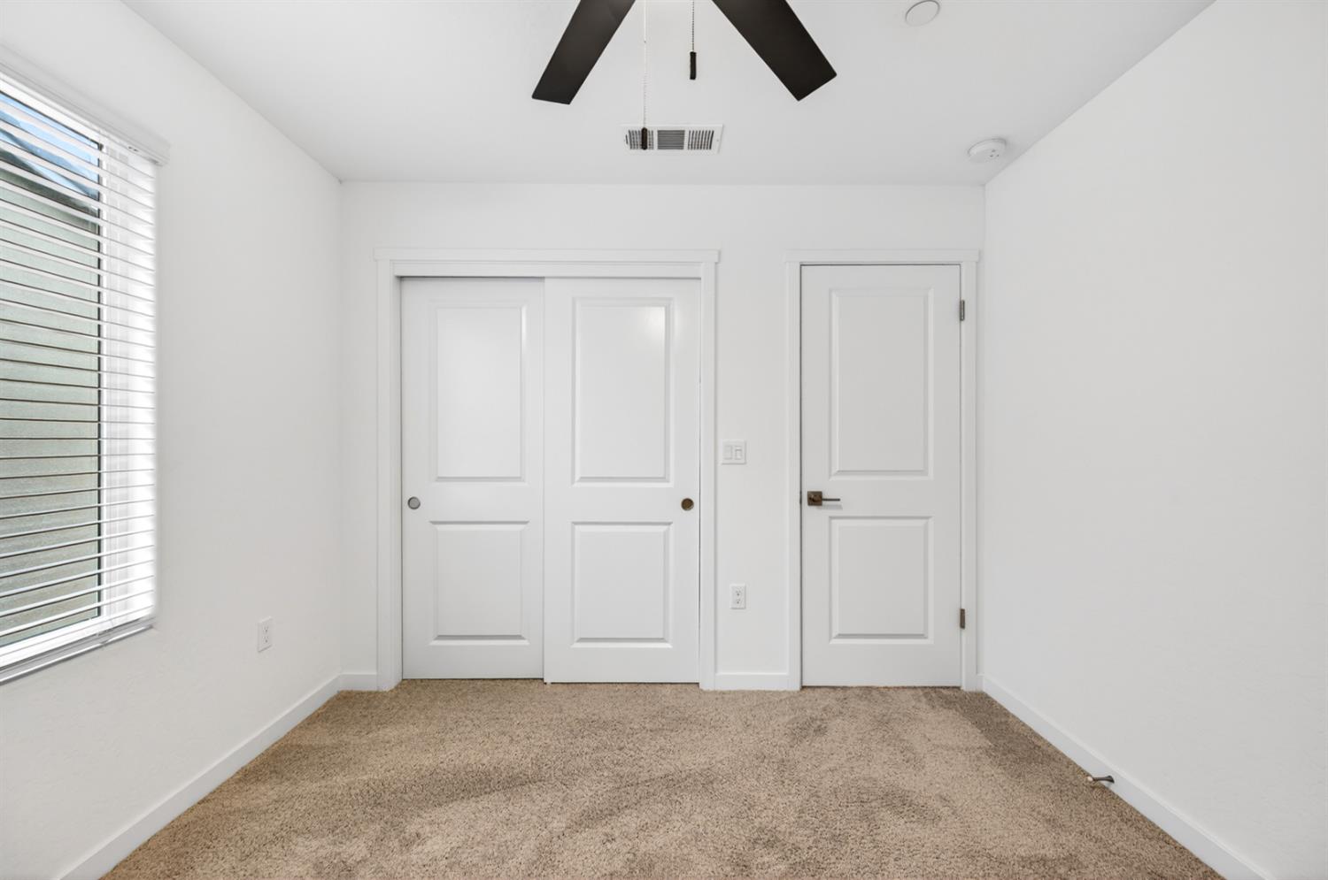 317 Talus Way South Madera, CA 93636 - Photo 45 of 61 an empty room with chandelier fan